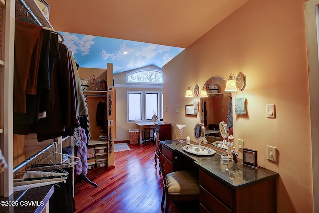 interior space featuring vaulted ceiling and wood finished floors