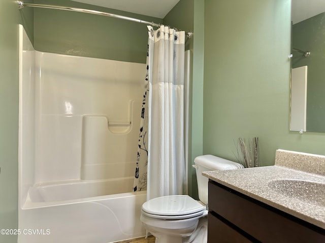 full bathroom featuring vanity, shower / bath combination with curtain, and toilet