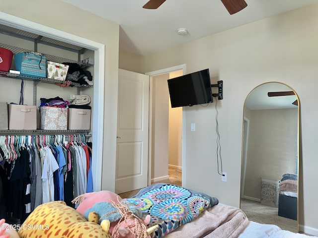 carpeted bedroom featuring ceiling fan