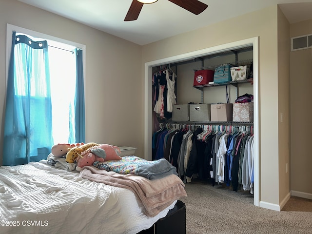 bedroom with carpet flooring, ceiling fan, and a closet