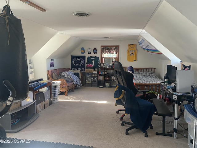 carpeted home office featuring vaulted ceiling