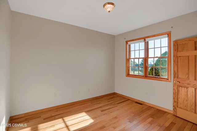 unfurnished room featuring light hardwood / wood-style floors