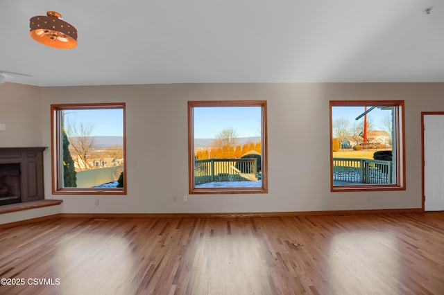 unfurnished living room featuring light hardwood / wood-style flooring