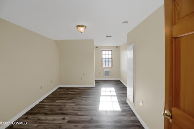 empty room with dark wood-type flooring