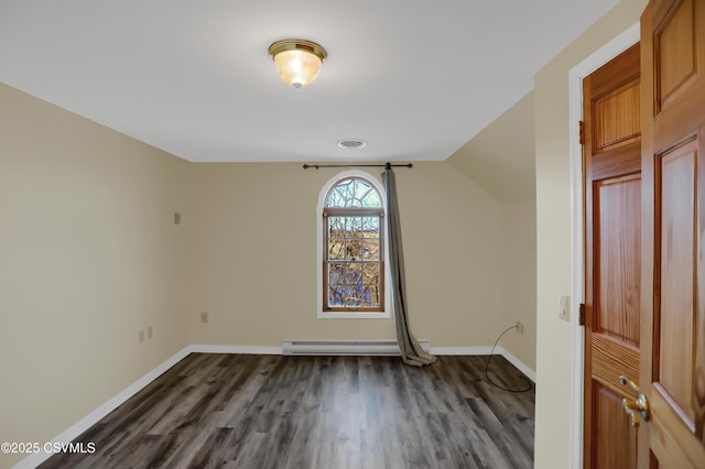 interior space with dark wood-type flooring and a baseboard radiator