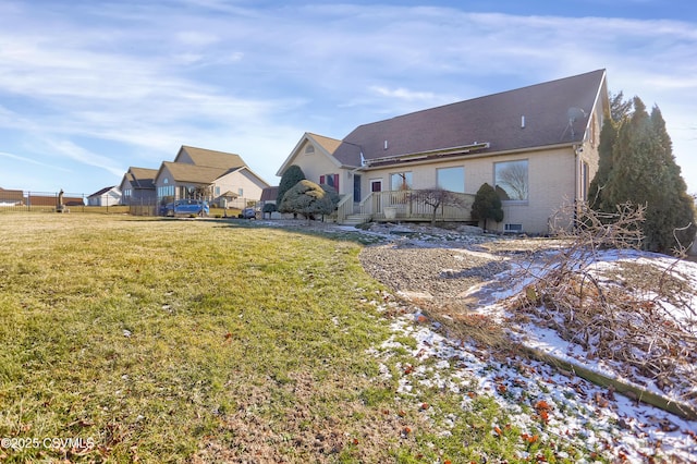 rear view of house with a lawn