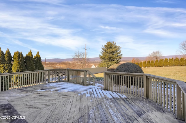 wooden deck featuring a mountain view