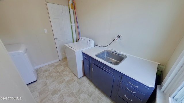 laundry room with washer / clothes dryer, sink, and cabinets