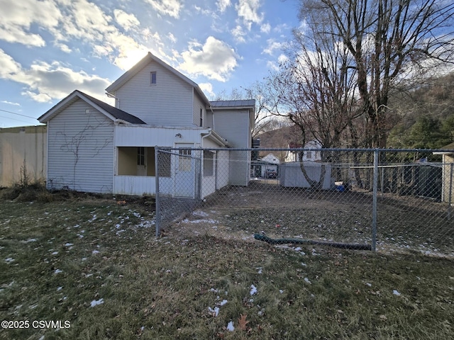 rear view of house with a lawn