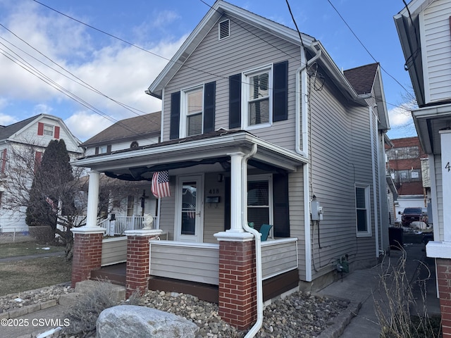 view of property with a porch