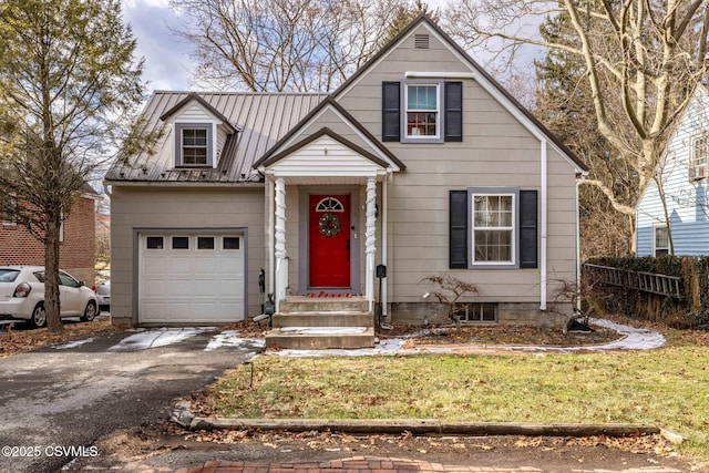 view of front of house with a front lawn and a garage