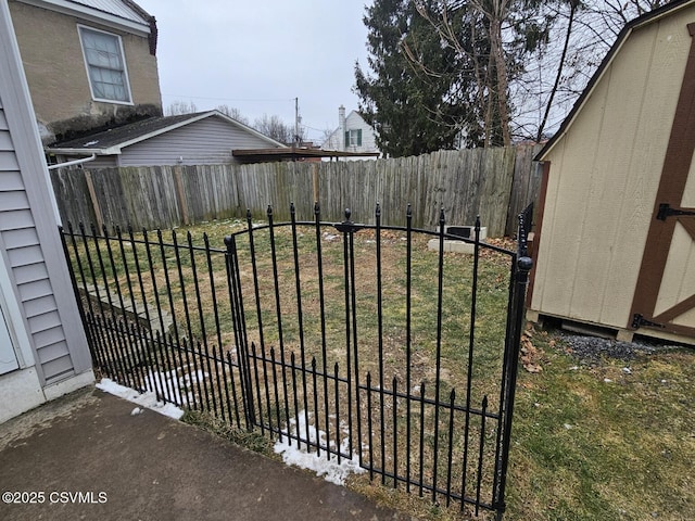 view of gate featuring a yard