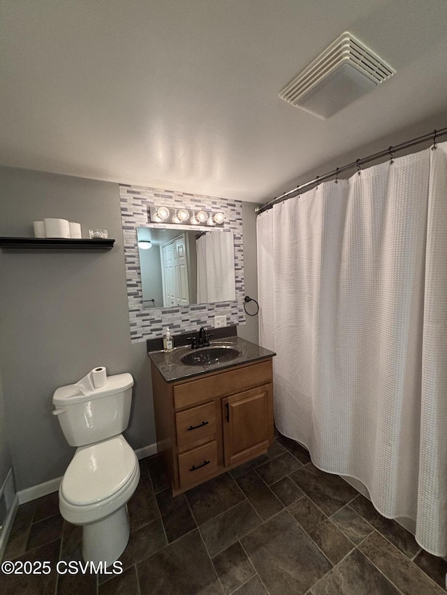 bathroom with tasteful backsplash, vanity, toilet, and a shower with shower curtain