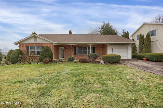 ranch-style home featuring a garage and a front yard