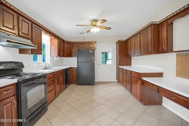 kitchen featuring sink, black appliances, light tile patterned floors, and ceiling fan