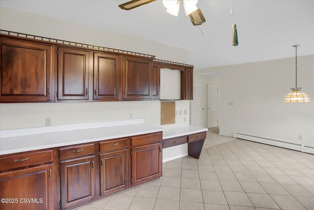 kitchen with decorative light fixtures, baseboard heating, ceiling fan, and light tile patterned floors