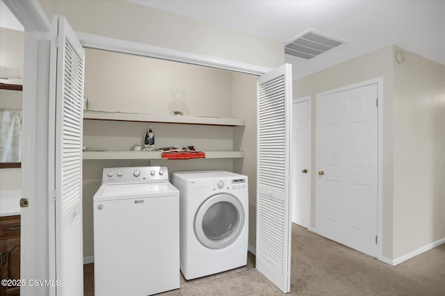 washroom with light carpet and washing machine and clothes dryer