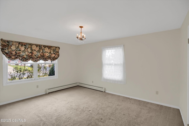 carpeted spare room with baseboard heating, a notable chandelier, and a healthy amount of sunlight