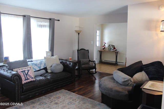 living room with dark wood-type flooring and a baseboard radiator