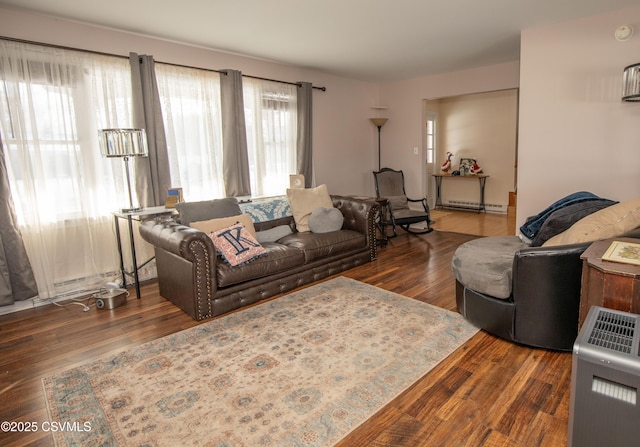 living room featuring a baseboard radiator and dark hardwood / wood-style floors