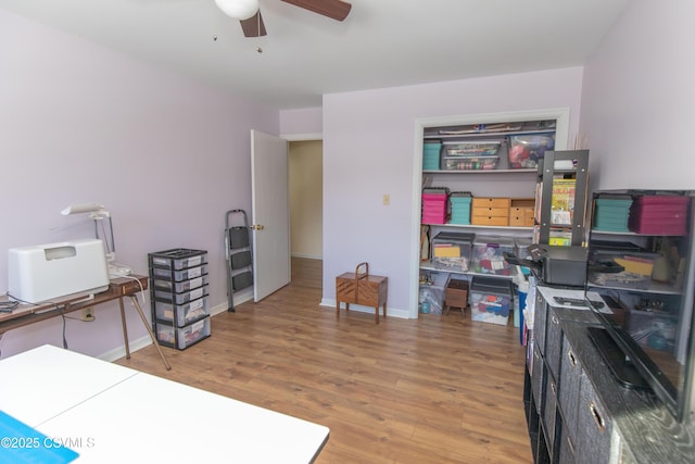 home office with ceiling fan and wood-type flooring