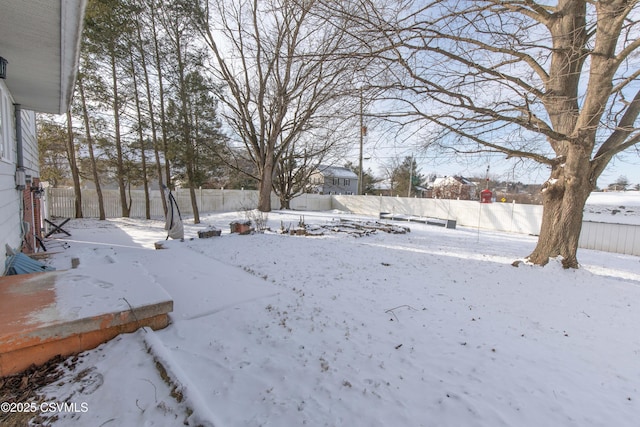 view of yard covered in snow