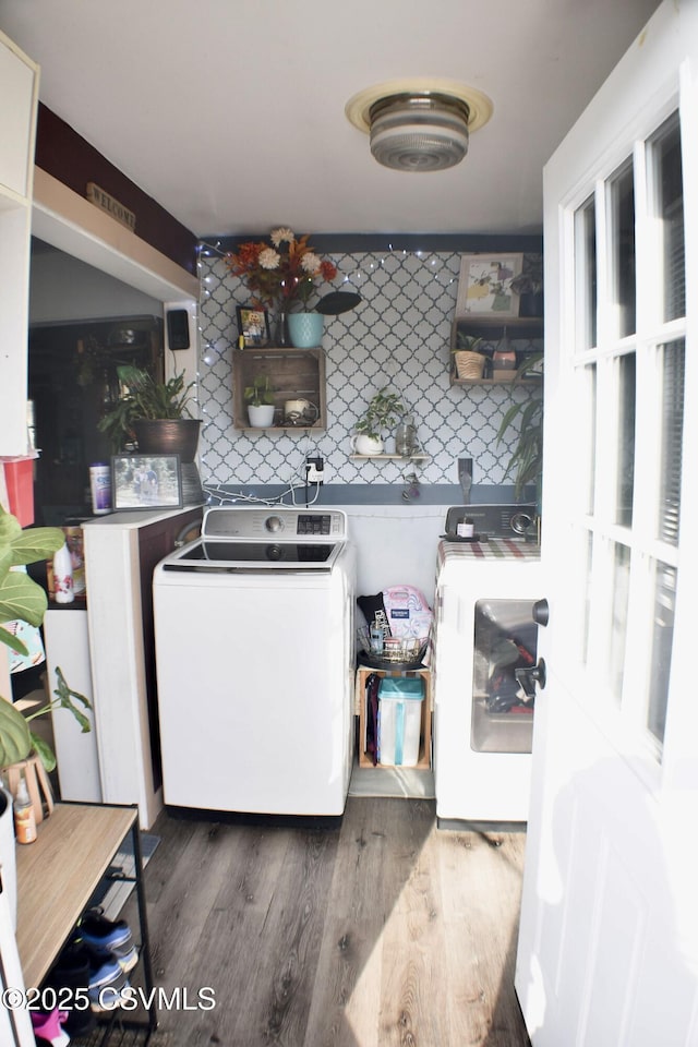 clothes washing area featuring dark hardwood / wood-style floors