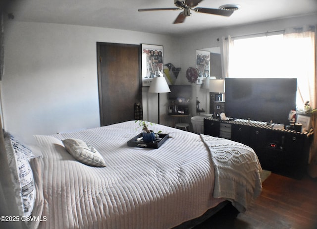 bedroom with ceiling fan and hardwood / wood-style floors