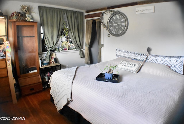 bedroom featuring dark wood-type flooring