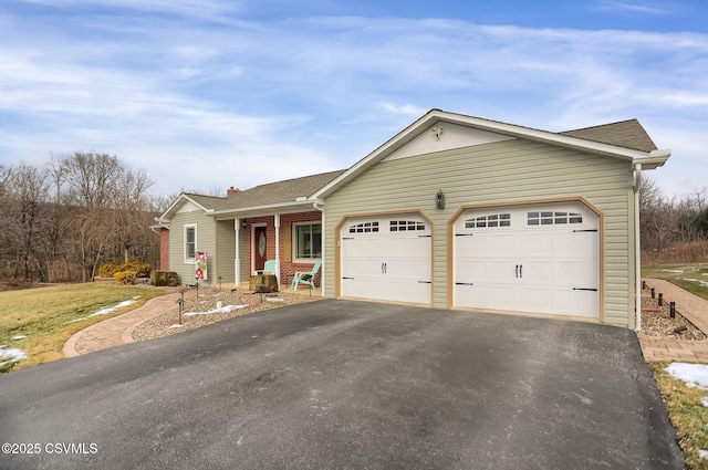 single story home featuring a garage