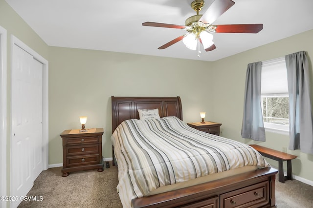 bedroom with ceiling fan, a closet, and light carpet