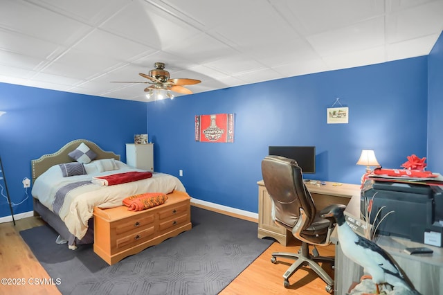 bedroom featuring ceiling fan and dark hardwood / wood-style floors