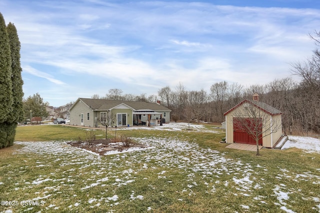 snowy yard featuring a storage shed