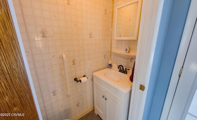 bathroom featuring tile walls and vanity