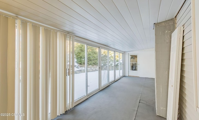 unfurnished sunroom featuring wooden ceiling