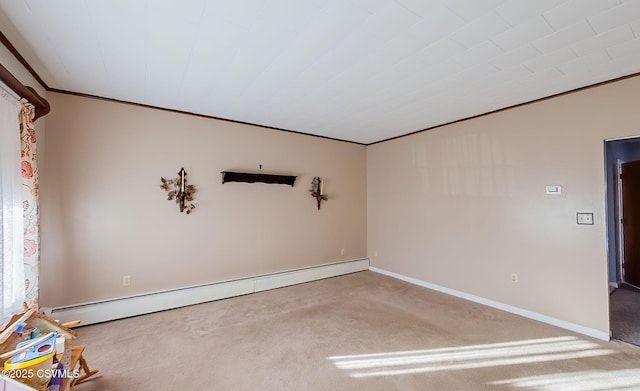 empty room featuring crown molding, a baseboard radiator, and carpet flooring