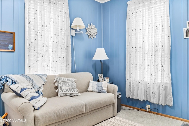 interior space featuring crown molding and carpet