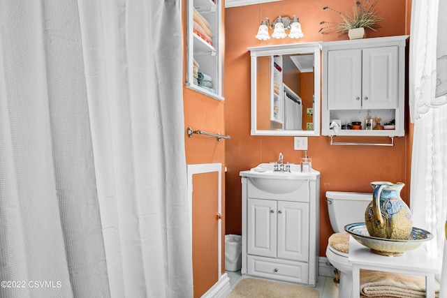 bathroom with vanity and toilet