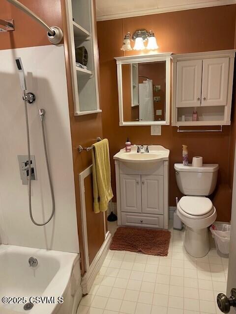 full bathroom featuring vanity, bathtub / shower combination, and toilet