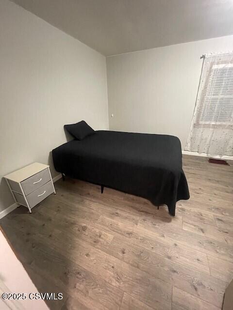 bedroom featuring hardwood / wood-style flooring