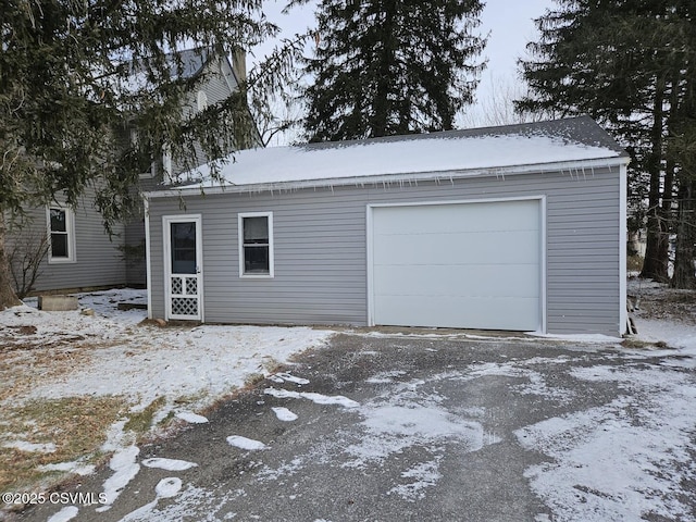 view of snow covered garage