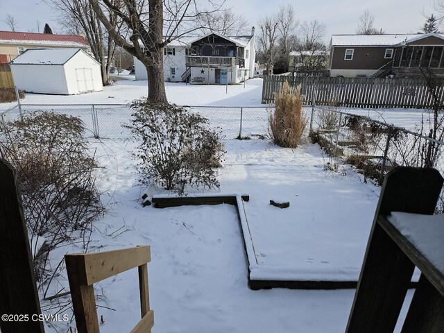 view of yard layered in snow