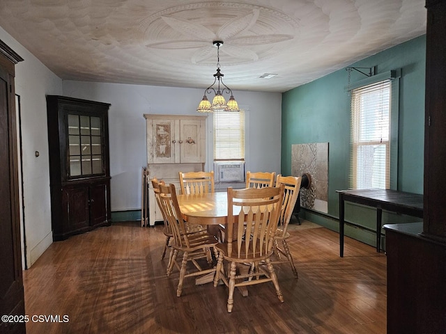 dining room featuring dark wood-type flooring and cooling unit