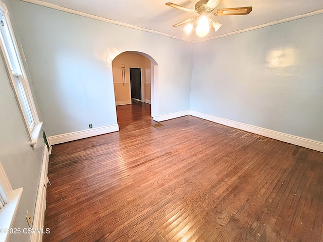 spare room featuring ceiling fan, crown molding, and dark hardwood / wood-style flooring