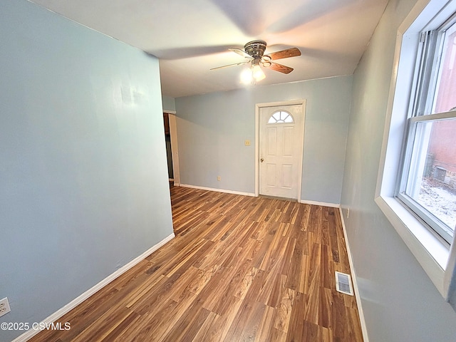 foyer featuring wood-type flooring and ceiling fan