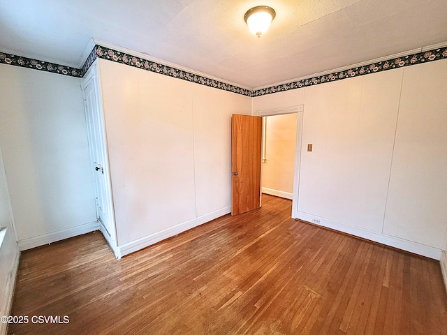 unfurnished bedroom featuring hardwood / wood-style floors