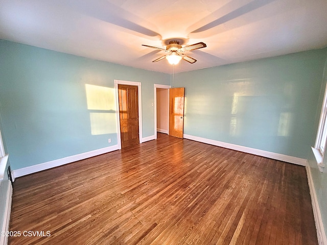 unfurnished bedroom with ceiling fan and dark hardwood / wood-style floors