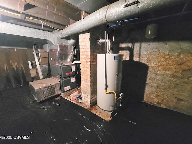 utility room with heating unit and gas water heater