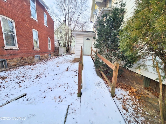 view of yard layered in snow