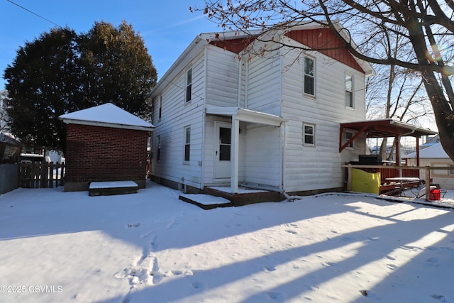 snow covered property with a gazebo